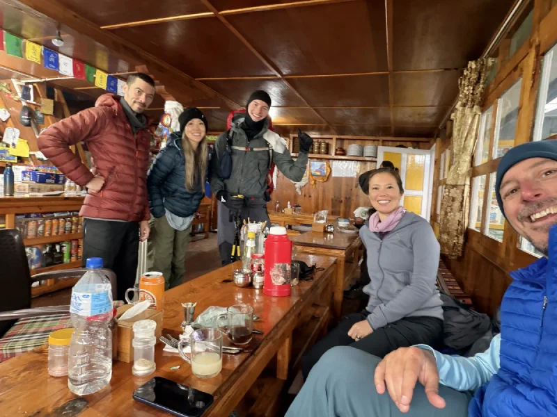 Sven and the group posing together in the wooden airport restaurant