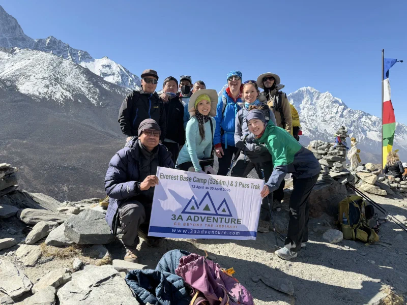 Group photo with EBC and 3 Pass Trek banner