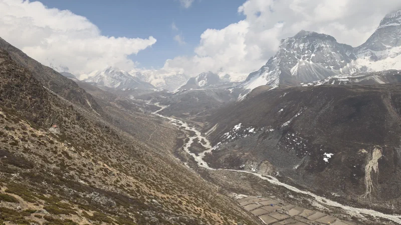 View down the Imja valley with braided riverbed and settlement