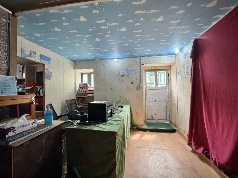 Clinic reception with cloud-painted ceiling