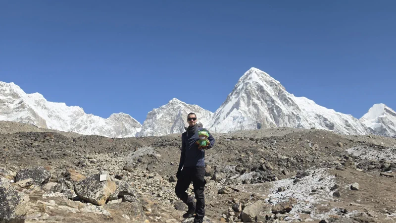 Nicholas holding Sumi with Pumori peak behind