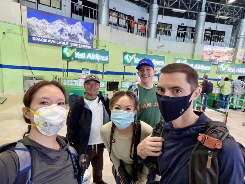 Group selfie at the airport check-in area