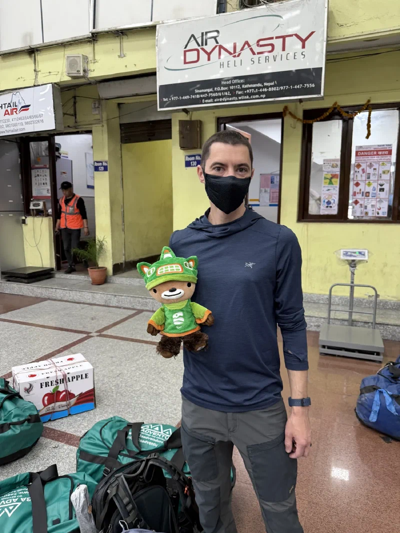 Nicholas holding Sumi at the Air Dynasty and Fishtail Air cargo area