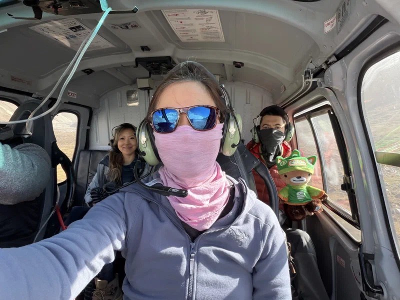 In-flight selfie with headsets during the flight from Gokyo