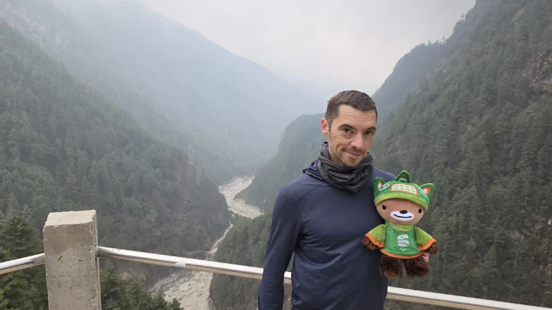 Nicholas and Sumi overlooking the foggy Dudh Koshi valley from high on the climb