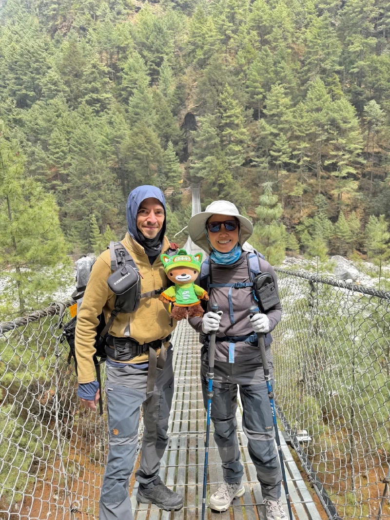 Nicholas and Po On posing on the suspension bridge