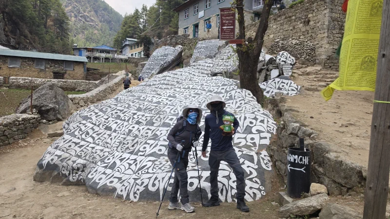 Pokin and Nicholas with Sumi at a large mani stone