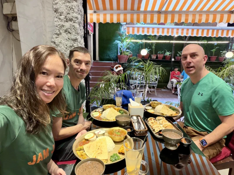 Pokin, Nicholas, and Steve eating dal bhat at a restaurant in Kathmandu