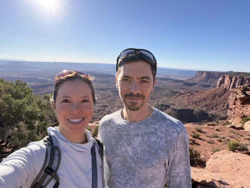 Pokin and Nicholas taking a selfie with canyon country behind them