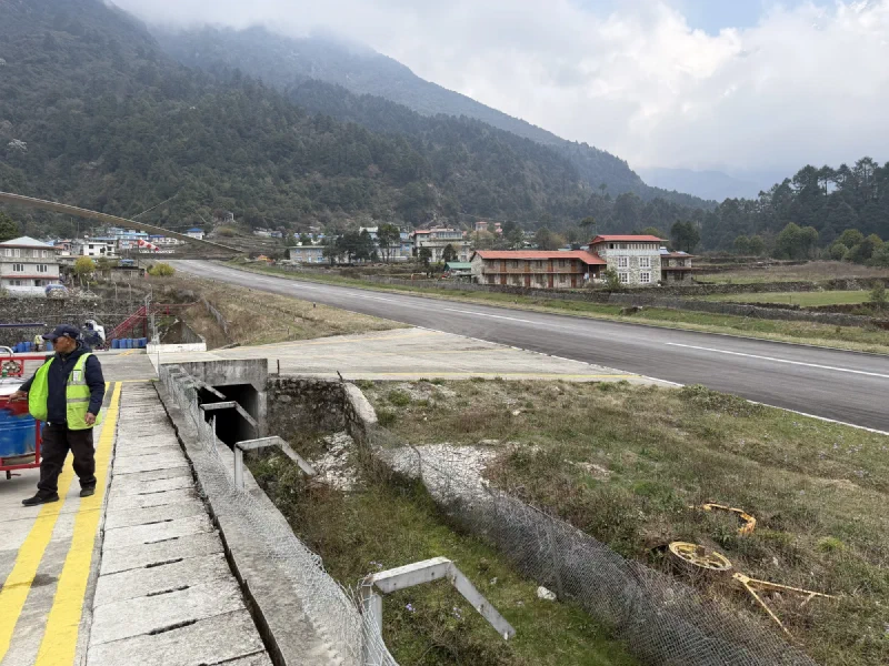 Lukla airport grounds with village buildings in the background