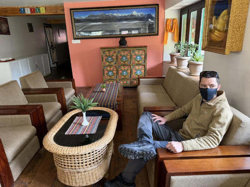 Nicholas resting in the lodge lounge, looking tired