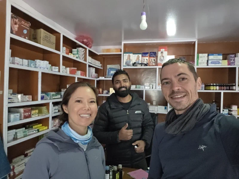 Pokin, Dr. Binod, and Nicholas taking selfie inside pharmacy