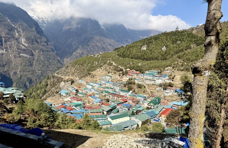Panoramic view of Namche Bazaar amphitheater from above with Himalayan peaks