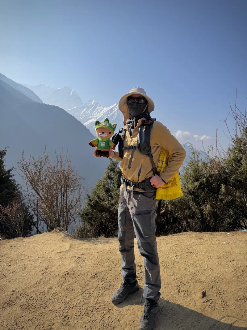 Nicholas holding Sumi on the trail
