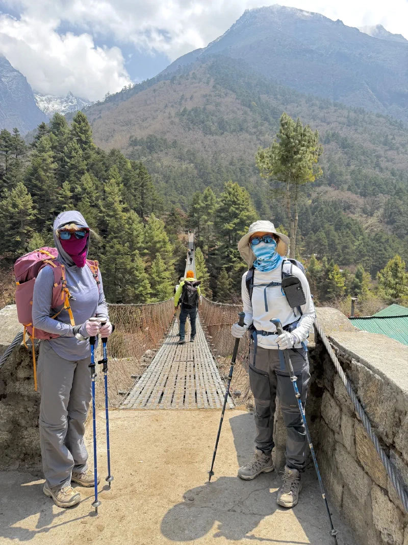 Pokin and Po On at a suspension bridge