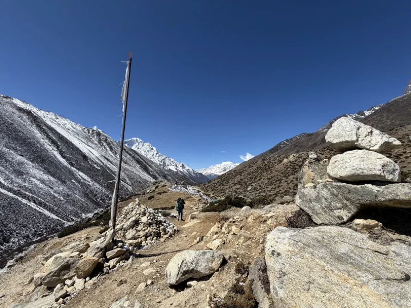 Cairns and a prayer flag along the trail