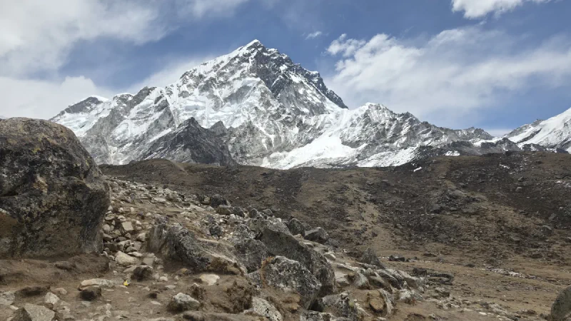 Rocky trail with mountain face