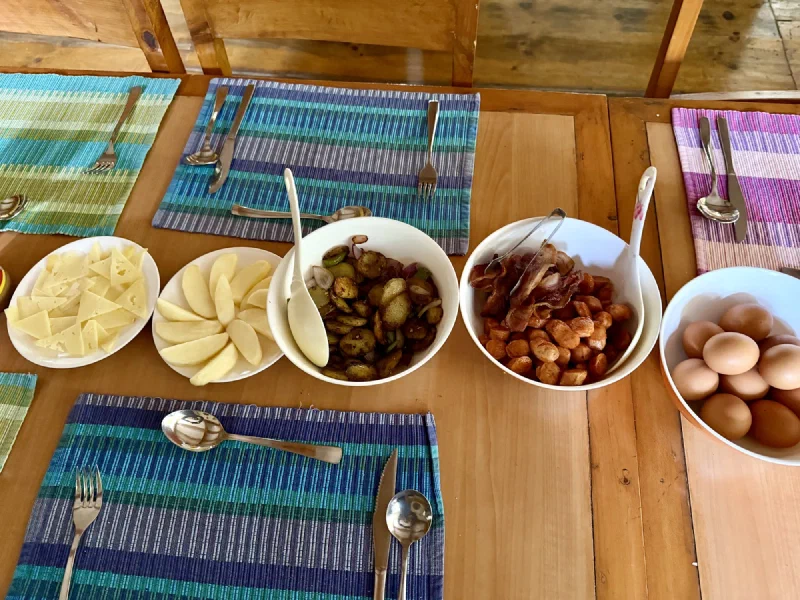 Breakfast spread at Sherpa Shangri-La with eggs, potatoes, fruit and cheese