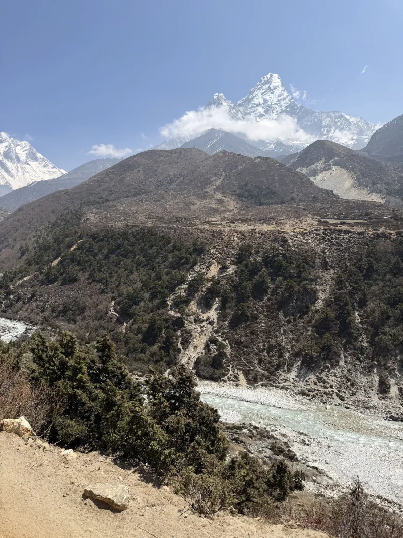 Ama Dablam rising above the valley with glacial river below