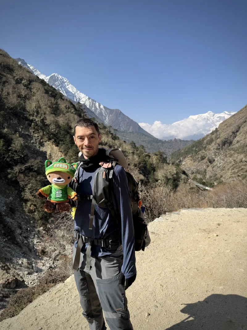 Nicholas holding Sumi on the trail