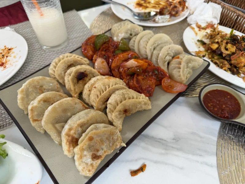 A large platter of Nepali momo dumplings