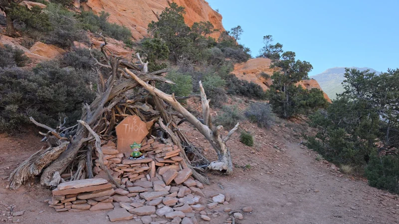 Wide shot of Thor's Chair stone throne structure on the trail